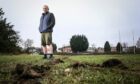 Club convenor Dougie Clark by the damage to the pitch. Image: Mhairi Edwards/DC Thomson.