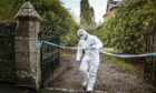 Police at the site of Dr Yule's death in Forfar. Image: Mhairi Edwards/ DC Thomson.