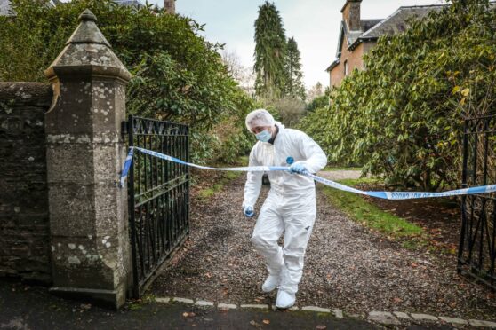 Police at the site of Dr Yule's death in Forfar. Image: Mhairi Edwards/ DC Thomson.