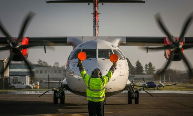 A Loganair flight taxis on the runway at Dundee Airport. Image: Mhairi Edwards/DCT Media