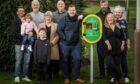 Jill Martin, front right, and neighbours on the Monifieth estate crowdfunded to raise money for the defibrillator. Image: DC Thomson/Mhairi Edwards.