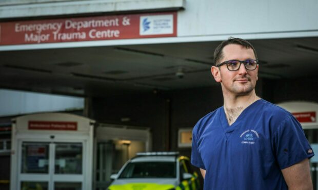 Dr Jamie Morrison, consultant in emergency medicine and clinical lead for the flow navigation centre at Ninewells Hospital in Dundee. Image by Mhairi Edwards/DC Thomson.