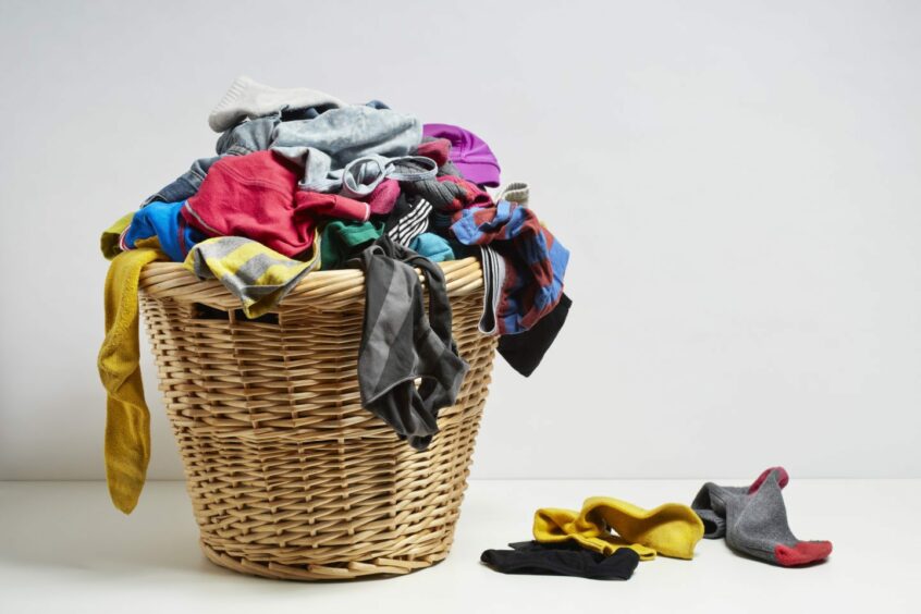 overflowing washing basket.