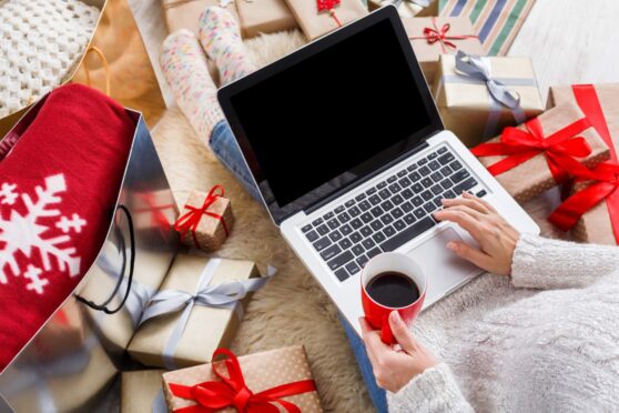 Person online shopping for Christmas presents.