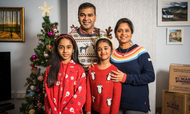 The Kumars - Praveen, Swarna, Tanvi Iona (11) and Tansi Isla (6) - will be sharing their Christmas joy and food with the people of Perth this year. Image: Supplied