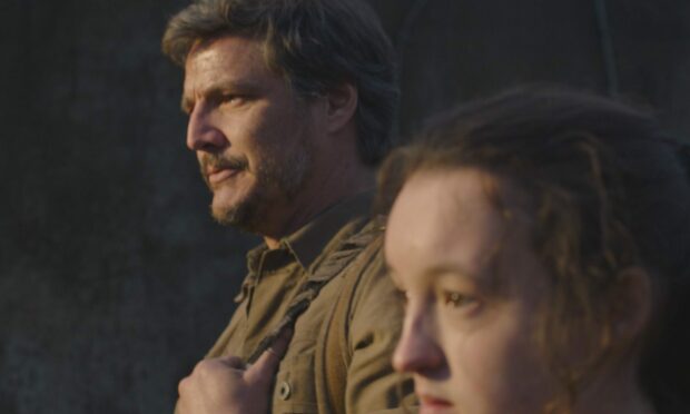 Joel Miller (Pedro Pascal) and Ellie Williams (Bella Ramsey) In The Last of Us.