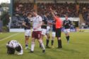 Ben Williamson is shown a red card against Arbroath.