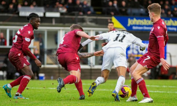 Arbroath weren't happy with the penalty call for this challenge on Ayr United star Jayden Mitchell-Lawson. Image: SNS