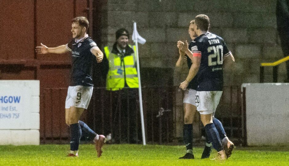 Jamie Gullan stands with arms outstretched after scoring for Raith against Linlithgow in the Scottish Cup in 2023.