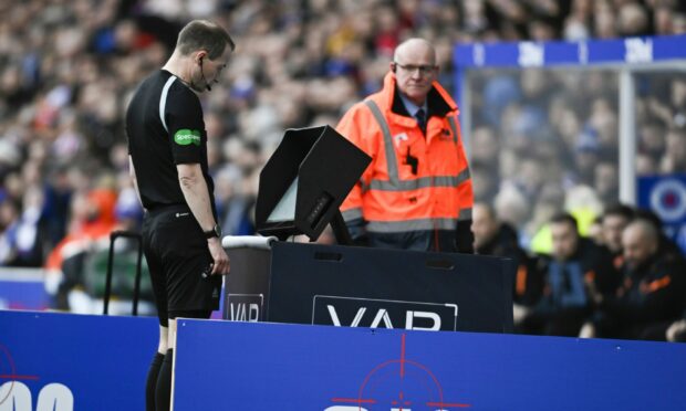 Willie Collum goes to the VAR monitor at Ibrox during Rangers v St Johnstone.