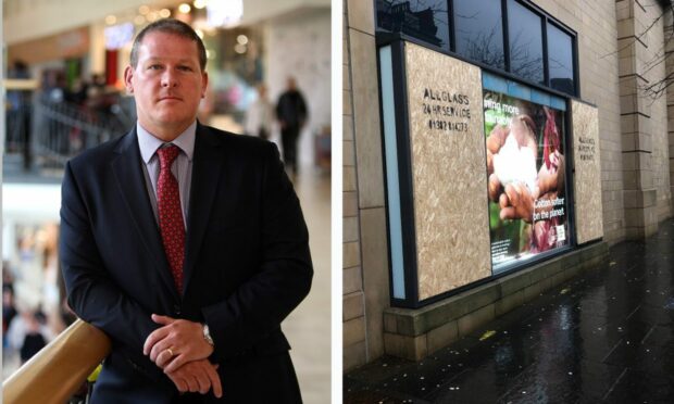 Malcolm Angus, Overgate manager, and  broken window panes at Primark this week. Image: DC Thomson