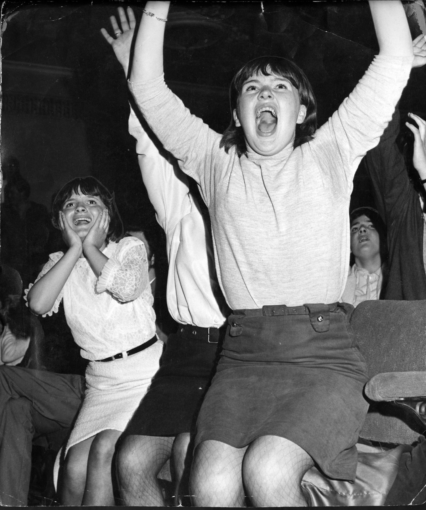 Girls leaping off seats and screaming at the Rolling Stones in June 1965.