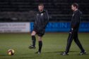 Officials inspect the water-logged Dens pitch last night. Image: Craig Brown.