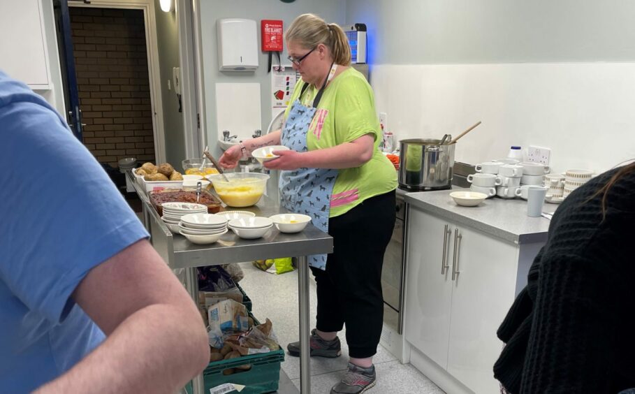 Cheryl preparing meals in the Just Bee kitchen. Image: Scottish National Lottery.