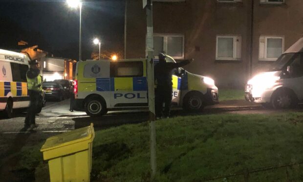 Large police police presence in Clement Park Place. Image: James Simpson/DC Thomson.