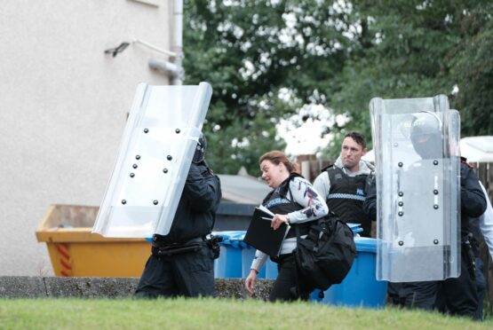 Riot police and negotiators were at the four-hour stand-off. Image: Jim Payne.