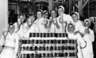 Keiller's staff hold up some of their products at the factory in 1982. Image: DC Thomson.