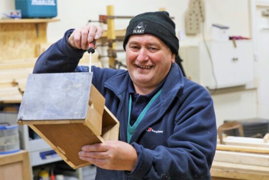 Arbroath shedder Tam Brown, 75, turns his hand to making a bird house. Image: Gareth Jennings/DC Thomson.