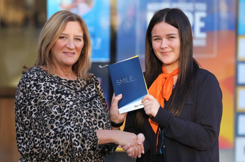 Jacqueline Souter gets her tickets from Sophie McFadyen