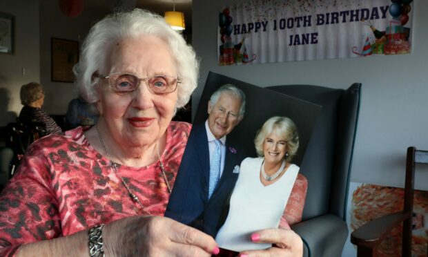 Jane Oliphant with her 100th birthday card from the King and Queen Consort. Image: Gareth Jennings/DC Thomson.