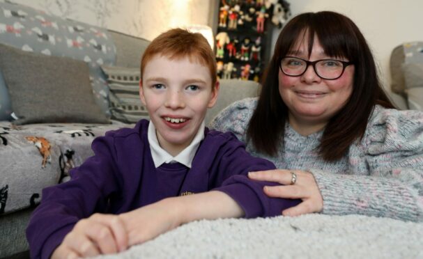 Jayden Read, 11, and mum Emma Jackson. Jayden has additional support needs and has been impacted by the teacher strikes. Image: Gareth Jennings/DC Thomson.