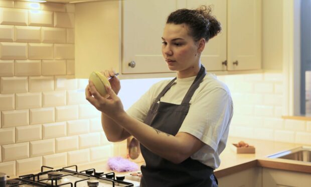 Owner of Chocolatia, Chloe Oswald in action creating her luxury chocolate. Image: Chloe Oswald