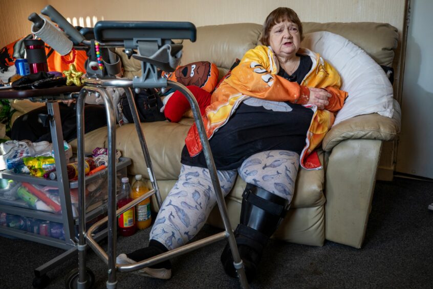 Carol in her first floor flat. 