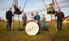 Youngsters Owen Millar, 7, Russell Simpson, 10, and Ben Simpson, 5, celebrate the Seagreen boost with community and windfarm figures at the park. Image: Kim Cessford/DC Thomson
