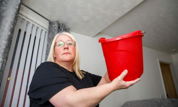 Nicola Smith, 41, has three ceiling leaks. Image: Kenny Smith/ DC Thomson