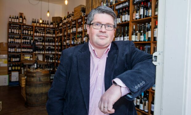 Peter Wood, owner of St Andrews Wine Company in his Bell Street store.