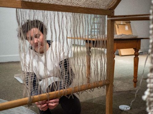 Lynne Hocking installing Ancestral Connections at Meffan Museum and Art Gallery. Image: Jeni Reid.