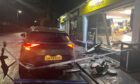 A car has smashed though the front window of the Premier shop on Claypotts Road in Broughty Ferry. Image: DC Thomson.