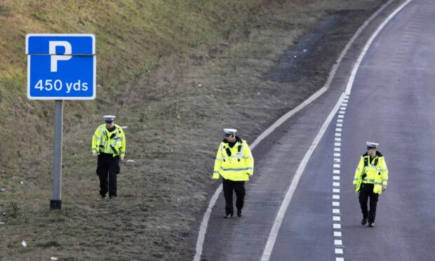 Police at the scene of the fatal A9 collision.