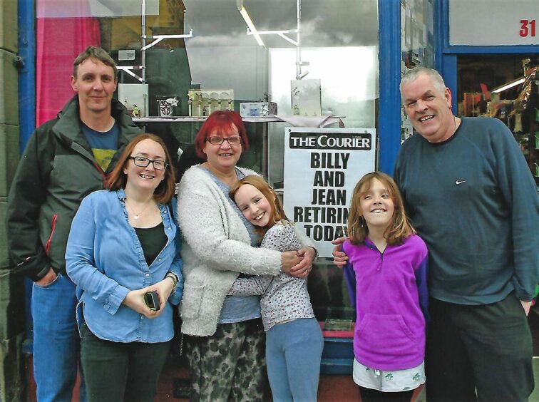 Billy (far right) and Jean Duff outside the shop on the day they retired, with son Scott (far left), his wife Heather and their children Holly and Cara