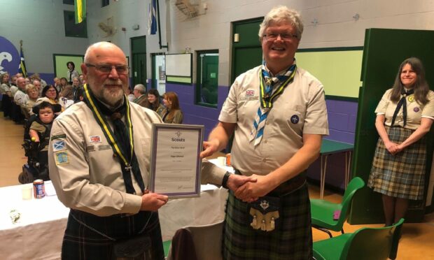 Roger Mitchell (left) with his Silver Wolf award after being presented by Callum Farquhar who is Scouting's regional commissioner for East Scotland. Image: Cupar Scout Group