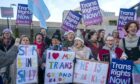 Supporters of the Gender Recognition Reform Bill (Scotland) take part in a protest outside the Scottish Parliament on December 20. Image: Jane Barlow/PA Wire