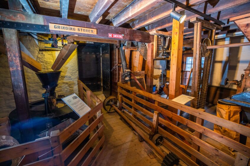 Lower city mills interior, showing old timber and mill machinery
