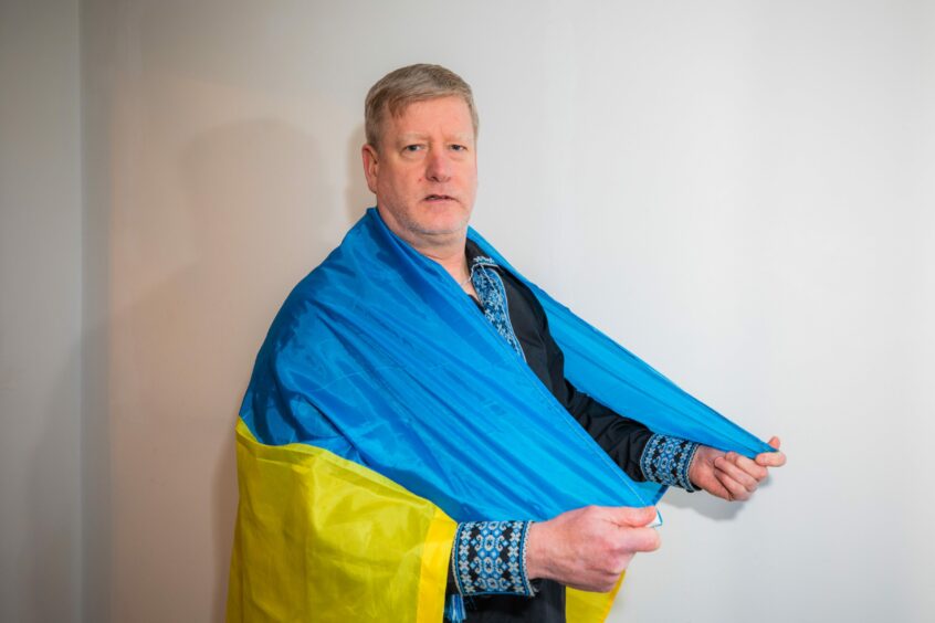 Steven Carr draped in Ukraine flag