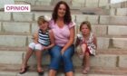 Seuna Walker sitting on steps on holiday with her two young daughters.