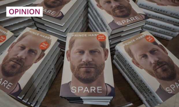 piles of copies of Prince Harry's memoir Spare.