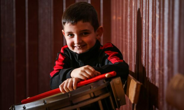 Adam Millar, 8, with his snare drum. Image: Mhairi Edwards/DC Thomson.
