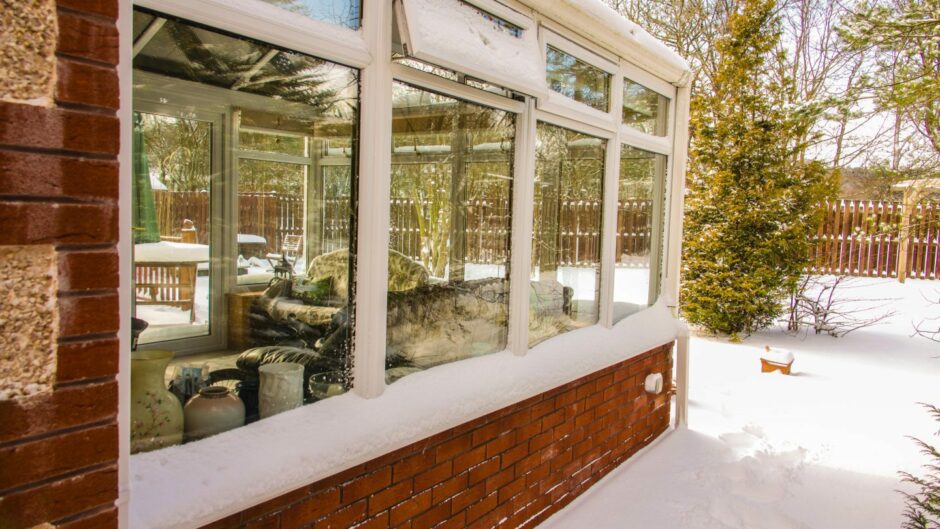 Conservatory with double glazing in the snow