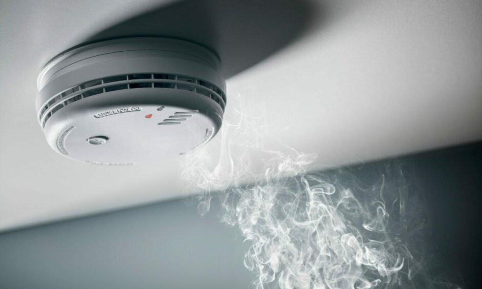Smoke creeping up to smoke detector on ceiling
