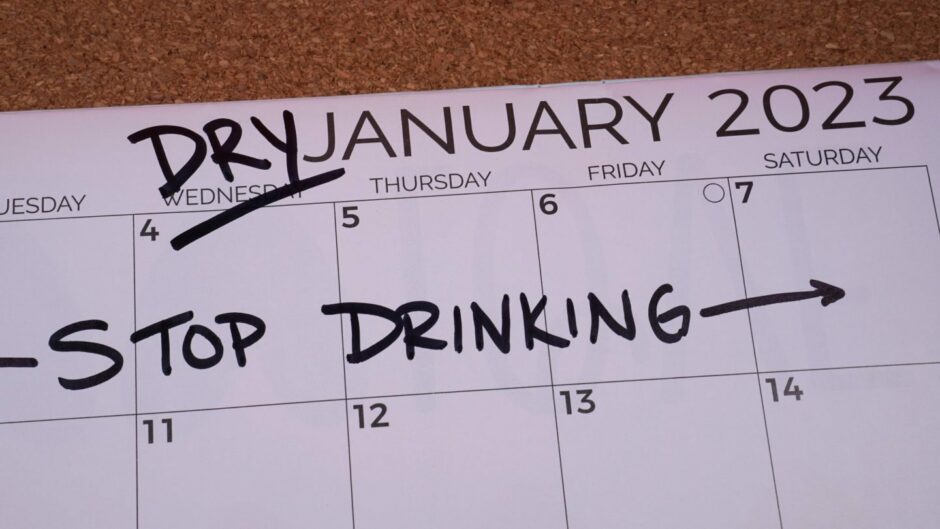 January 2023 calendar page, with the words 'Stop drinking' written across it.