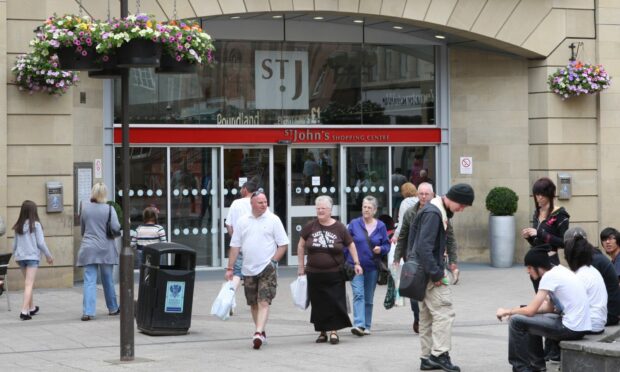 St John's Shopping centre entrance with shoppers walking to and fro