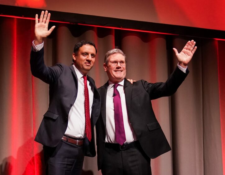 Scottish Labour leader Anas Sarwar on the party conference stage with Labour leader Sir Keir Starmer