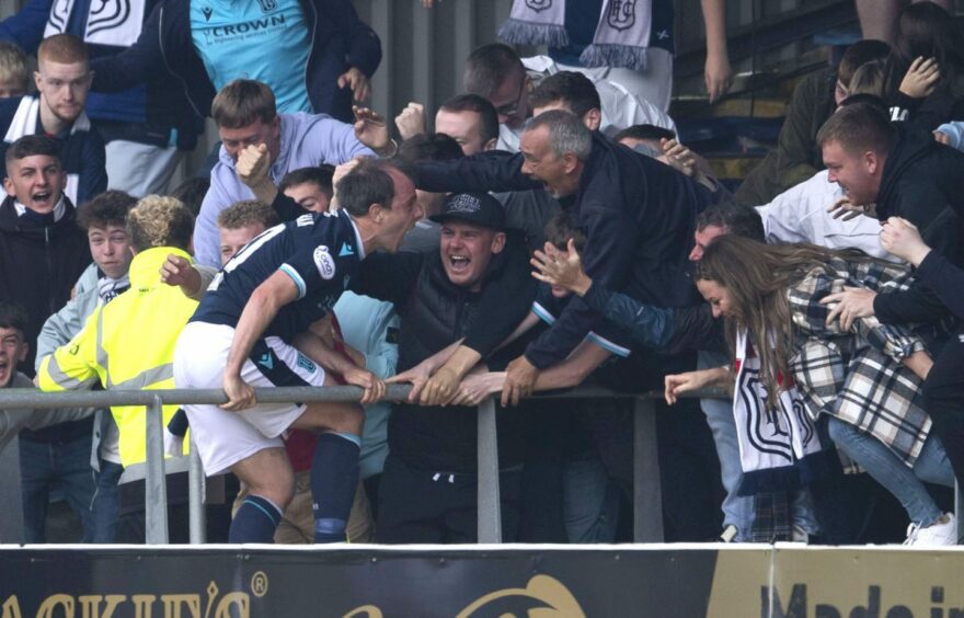 Paul McGowan celebrates with Dundee fans