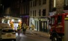 Police have closed Forfar High Street following a fire. Image: Paul Reid.