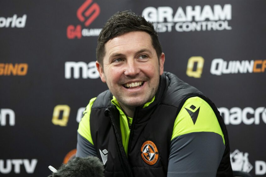Liam Fox is all smiles at a press conference during his time as Dundee United boss.
