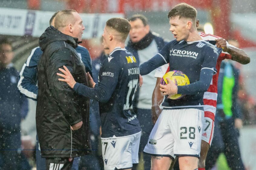 Tempers boil at Hamilton after Accies assistant Darian MacKinnon (left) and Dundee defender Sam Fisher (right) clash